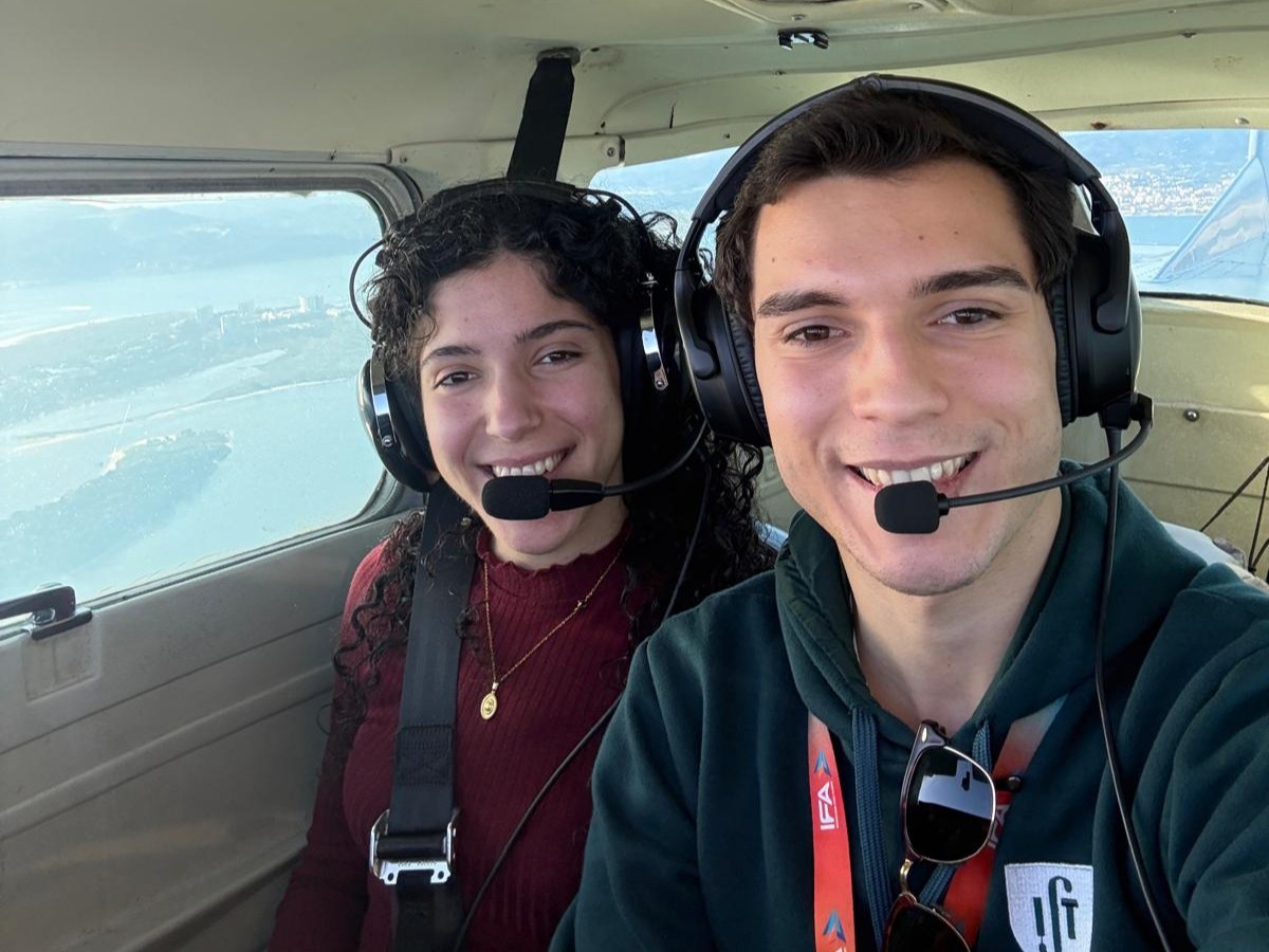 Two passengers smiling in a SkyFuns cockpit